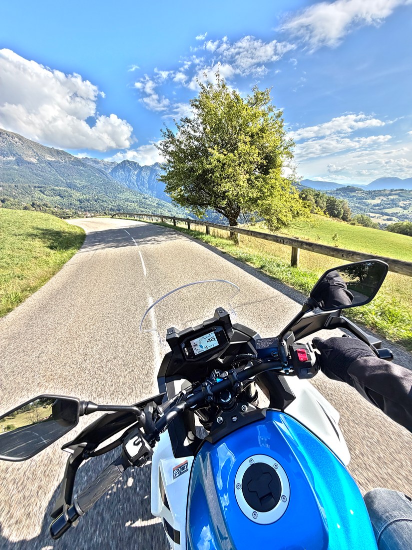 View from the handlebars of the Suzuki SV-7GX on the Belledonne balcony road, the Grésivaudan below